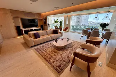 Apartamento minimalista com área gourmet e varanda.